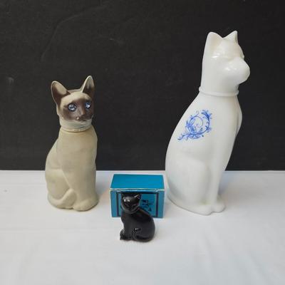 Avon Collectible cat cologn bottles and a cute cat tape measure - also Avon