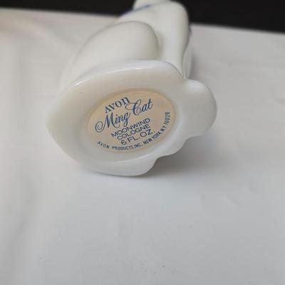 Avon Collectible cat cologn bottles and a cute cat tape measure - also Avon