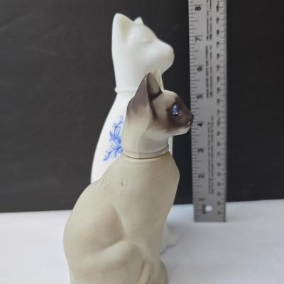 Avon Collectible cat cologn bottles and a cute cat tape measure - also Avon