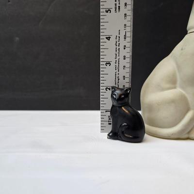 Avon Collectible cat cologn bottles and a cute cat tape measure - also Avon