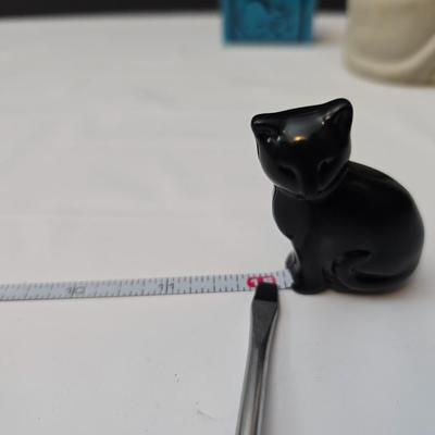 Avon Collectible cat cologn bottles and a cute cat tape measure - also Avon