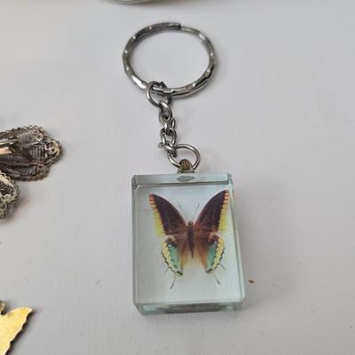 Butterfly brooch pins, necklace, keychain, windchimes, flower bouquet and more