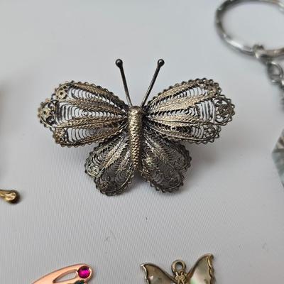 Butterfly brooch pins, necklace, keychain, windchimes, flower bouquet and more