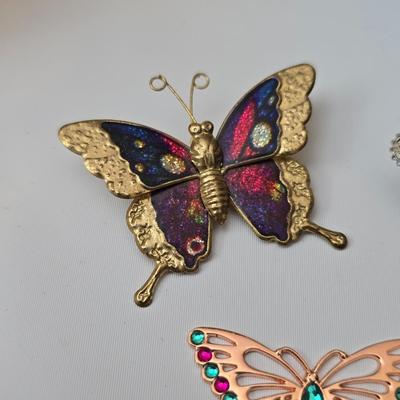 Butterfly brooch pins, necklace, keychain, windchimes, flower bouquet and more