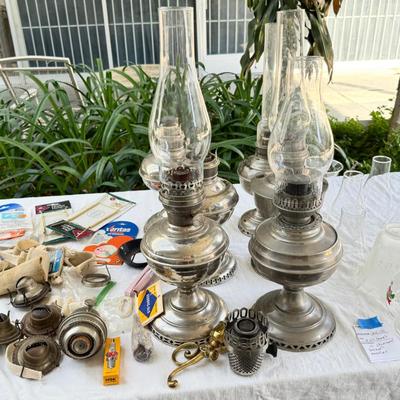 Antique oil lamps, chimneys, burners, wicks