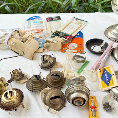 Antique oil lamps, chimneys, burners, wicks