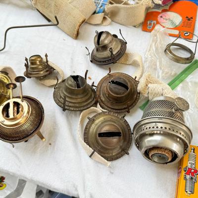 Antique oil lamps, chimneys, burners, wicks