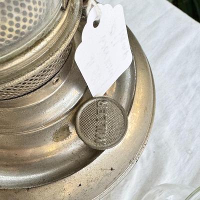 Antique oil lamps, chimneys, burners, wicks