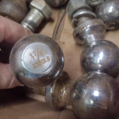 Assortment of Various Sized Trailer Ball Hitches and Hitch Attachments