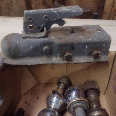 Assortment of Various Sized Trailer Ball Hitches and Hitch Attachments