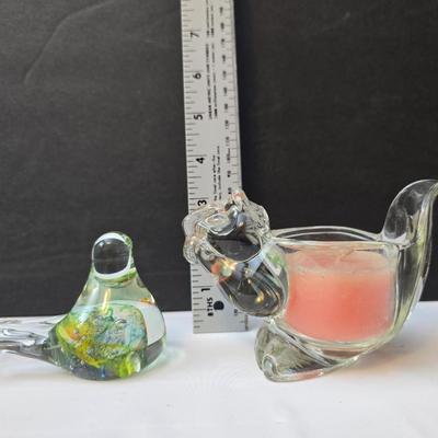 Blown glass bird and a clear glass squirrel candle holder