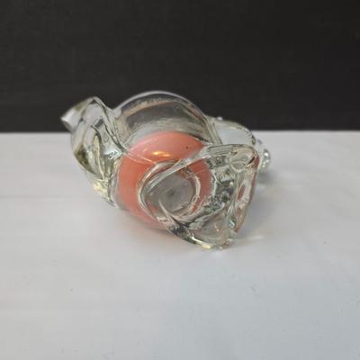 Blown glass bird and a clear glass squirrel candle holder