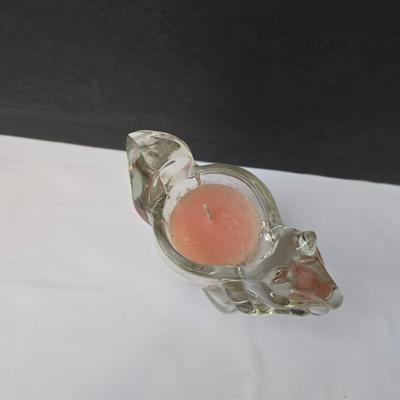 Blown glass bird and a clear glass squirrel candle holder