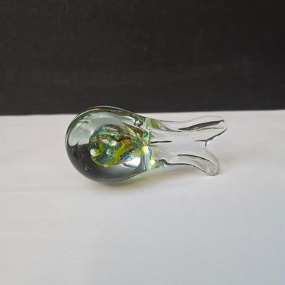 Blown glass bird and a clear glass squirrel candle holder