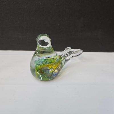 Blown glass bird and a clear glass squirrel candle holder