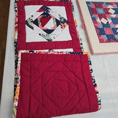 Collection of quilted fabrics - wall hanging - pillow case - table runner - and more