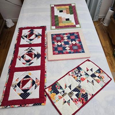 Collection of quilted fabrics - wall hanging - pillow case - table runner - and more