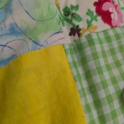 Beautiful vintage handmade quilt with colored patchwork