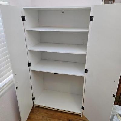White two-door closet cabinet - storage cabinet with adjustable shelves