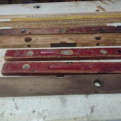 Assortment of Vintage Wood Framed Levels and Advertising Yard Sticks