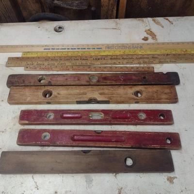 Assortment of Vintage Wood Framed Levels and Advertising Yard Sticks