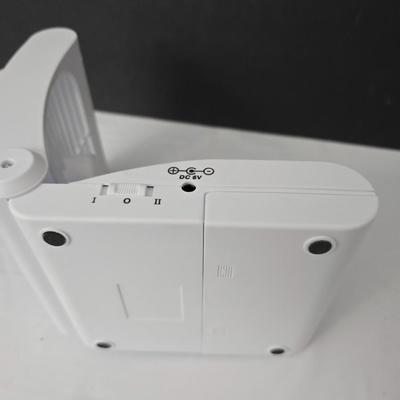 Working battery operated Personal fan - battery operated alarm clock and a large light up magnify glass