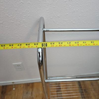 Fold away chrome clothes rack / closet organizer with matching shoe rack and an over the door hanger.