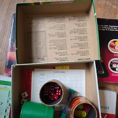 Assortment of fun board games - Racko - Word Yahtzee - Uno wild tiles - upwords and more