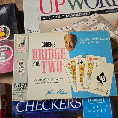 Assortment of fun board games - Racko - Word Yahtzee - Uno wild tiles - upwords and more