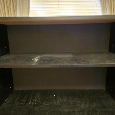 Small black bookshelf with adjustable shelving
