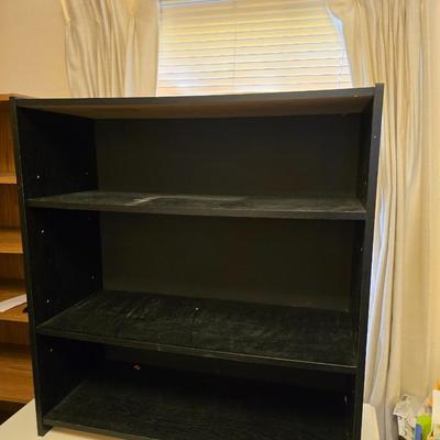 Small black bookshelf with adjustable shelving