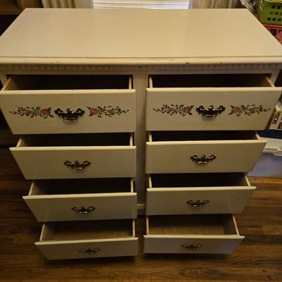 Vintage wooden 8 drawer dresser with design on two drawers
