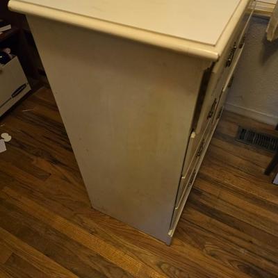 Vintage wooden 8 drawer dresser with design on two drawers