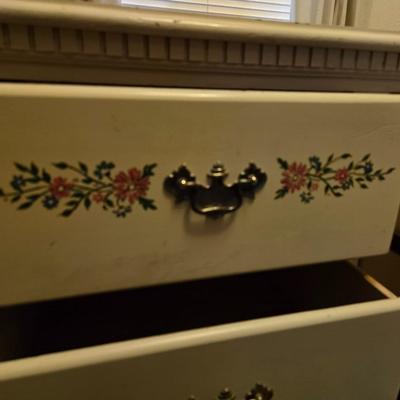 Vintage wooden 8 drawer dresser with design on two drawers