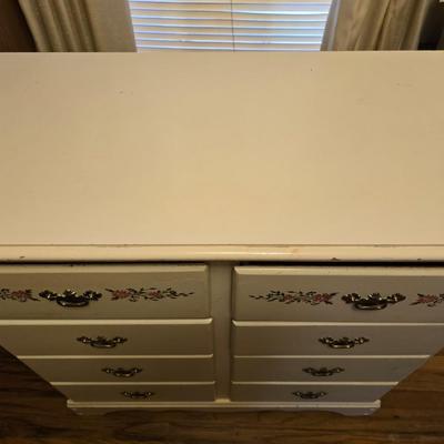 Vintage wooden 8 drawer dresser with design on two drawers