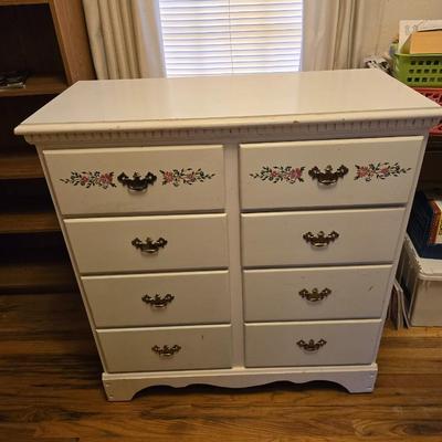 Vintage wooden 8 drawer dresser with design on two drawers