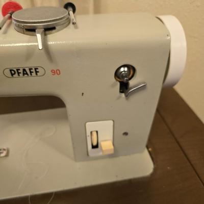 Pfaff 90 sewing machine in sewing machine cabinet with accessories - powers on and runs!