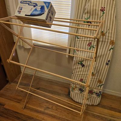 Two Laundry wooden drying racks with iron and ironing board