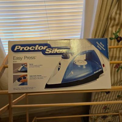 Two Laundry wooden drying racks with iron and ironing board