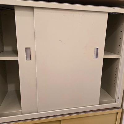 Two vintage metal base cabinet storage with sliding doors