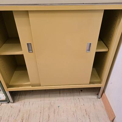 Two vintage metal base cabinet storage with sliding doors