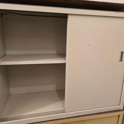 Two vintage metal base cabinet storage with sliding doors