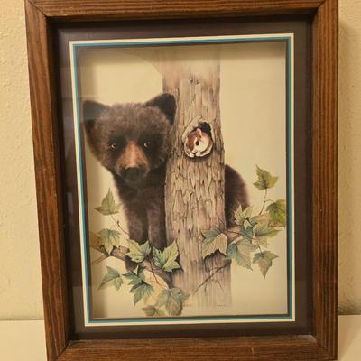 Framed bear cub wall art with assortment of rock artwork, a pewter bear, and other "nature like" decorations