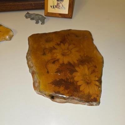 Framed bear cub wall art with assortment of rock artwork, a pewter bear, and other "nature like" decorations