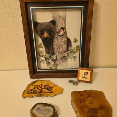 Framed bear cub wall art with assortment of rock artwork, a pewter bear, and other "nature like" decorations