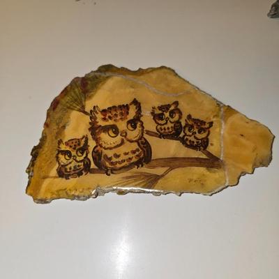 Framed bear cub wall art with assortment of rock artwork, a pewter bear, and other "nature like" decorations