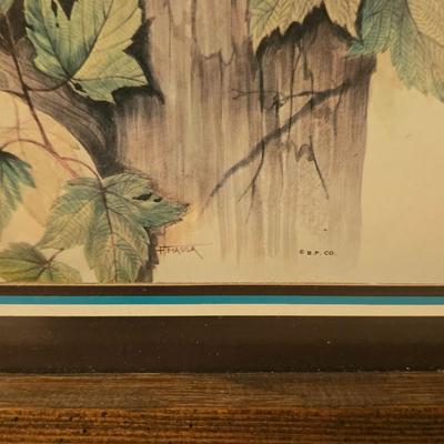 Framed bear cub wall art with assortment of rock artwork, a pewter bear, and other "nature like" decorations