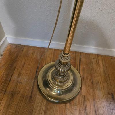 Brass floor lamp holds 4 bulbs for ultimate lighting!