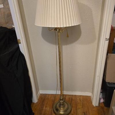 Brass floor lamp holds 4 bulbs for ultimate lighting!