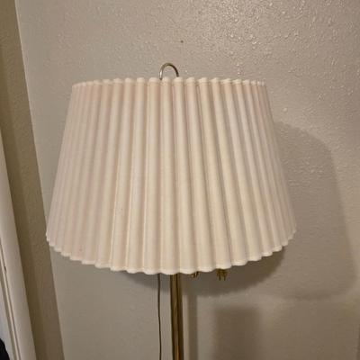Brass floor lamp holds 4 bulbs for ultimate lighting!